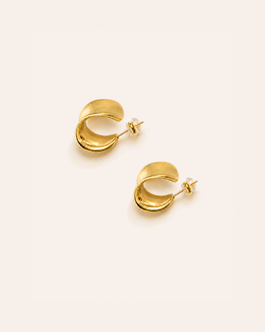 A pair of chunky waterproof hoops on a plain background